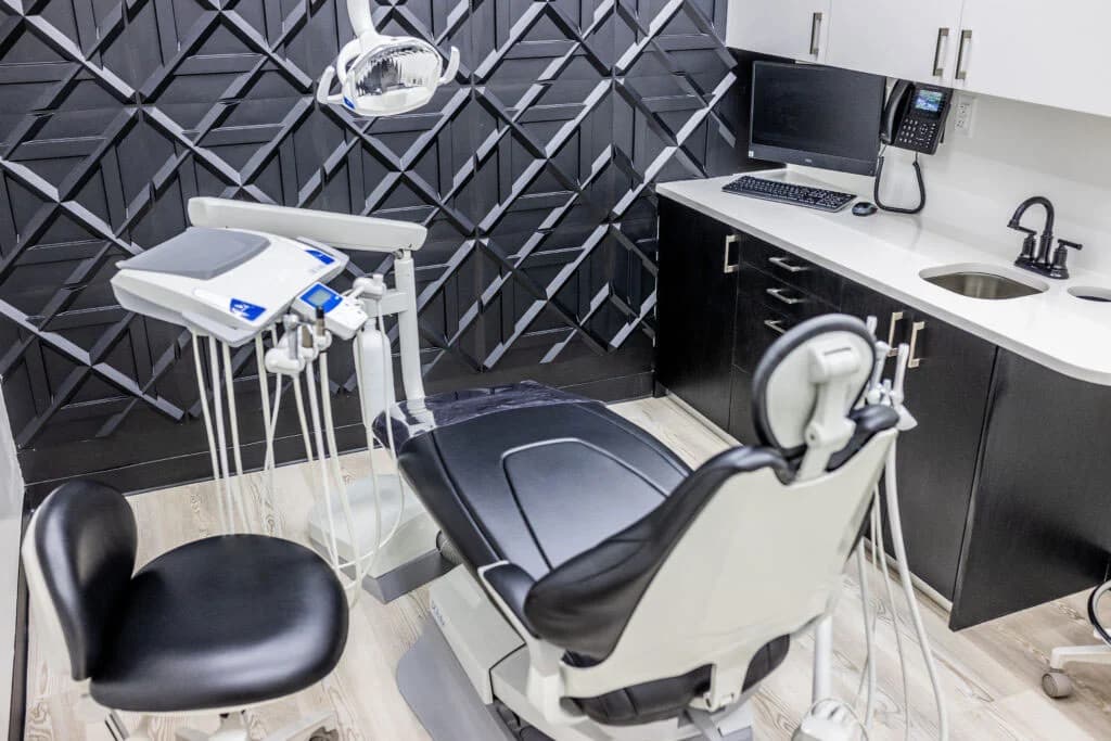 photo-modern-dental-chair-and-equipment-inside-black-and-white-clinic-room